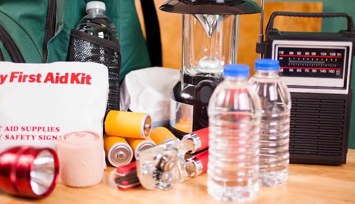 Materials useful in an emergency, including first aid kit, flashlight, bottled water, batteries, can